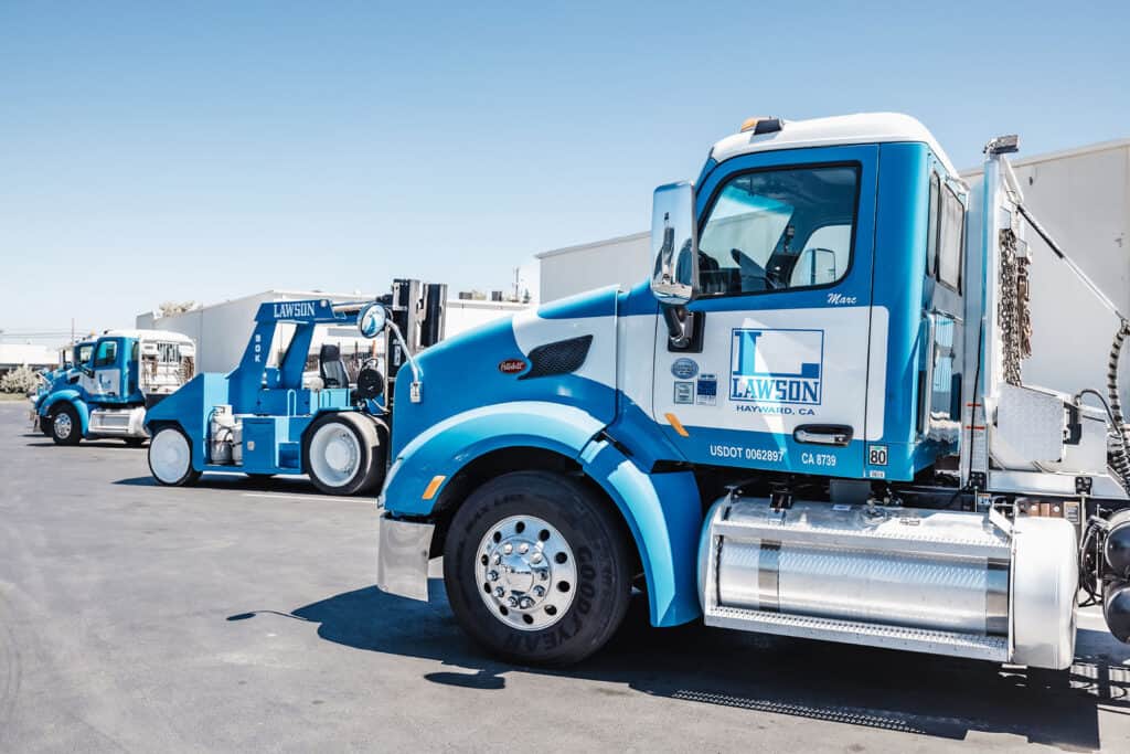 Side view of Lawson Drayage truck representing import export services and logistics operations supporting heavy hauling and transportation compliance under company terms and conditions